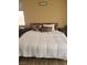 Comfortable main bedroom with a well-made bed, decorative pillows, and matching nightstands at 9589 Comiskey Ct, Las Vegas, NV 89148