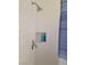 Tiled shower with shower head and built in shelving niche at 9589 Comiskey Ct, Las Vegas, NV 89148