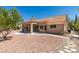 Charming backyard with desert landscaping, a covered patio, and a peaceful outdoor space at 9800 Rosamond Dr, Las Vegas, NV 89134