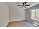 Bedroom featuring a ceiling fan and a window with neighborhood views at 9800 Rosamond Dr, Las Vegas, NV 89134