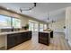 Spacious open-concept kitchen with a large island and a dining area at 9800 Rosamond Dr, Las Vegas, NV 89134