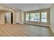 Bright living area with hardwood floors and windows offering a scenic view at 9800 Rosamond Dr, Las Vegas, NV 89134