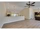 Open concept living area with hardwood floors that connects seamlessly with the kitchen at 9800 Rosamond Dr, Las Vegas, NV 89134