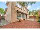 This home features a cozy backyard with a patio and low-maintenance rock landscaping at 9893 Santa Ponsa Ct, Las Vegas, NV 89178