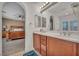 Bathroom with dual sinks and a view into the bedroom at 9893 Santa Ponsa Ct, Las Vegas, NV 89178