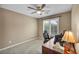 Neutral bedroom with window and office setup at 9893 Santa Ponsa Ct, Las Vegas, NV 89178