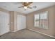 Bedroom with a double door closet and a window at 9893 Santa Ponsa Ct, Las Vegas, NV 89178