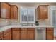 Charming kitchen features tile countertops, stainless steel appliances, and wooden cabinets at 9893 Santa Ponsa Ct, Las Vegas, NV 89178