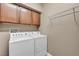Functional laundry room with white washer and dryer at 9893 Santa Ponsa Ct, Las Vegas, NV 89178