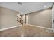 Bright living room with hardwood floors, a staircase, and neutral paint for a modern feel at 9893 Santa Ponsa Ct, Las Vegas, NV 89178