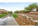 Community walking path with drought tolerant landscaping at 9893 Santa Ponsa Ct, Las Vegas, NV 89178