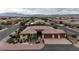 Stunning aerial shot of a single-Gathering home highlighting the tile roof, lush landscaping, and mountain views at , Las Vegas, NV 89113