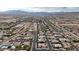 Extensive aerial shot showcasing a vast suburban neighborhood with diverse homes, swimming pools, and mountain views at , Las Vegas, NV 89113