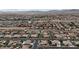 Wide aerial view of a dense residential area featuring varied architectural styles, desert landscape, and organized street grids at , Las Vegas, NV 89113