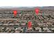 Wide aerial view of residential area with mountain backdrop, nearby cross streets identified by red pins at , Las Vegas, NV 89113