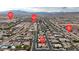 Wide aerial view of residential area with mountain backdrop, nearby cross streets identified by red pins at , Las Vegas, NV 89113