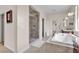 Elegant bathroom featuring a glass shower, soaking tub, and vanity with ample storage at , Las Vegas, NV 89113