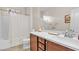 Bathroom with dark wood vanity and enclosed tub at , Las Vegas, NV 89113