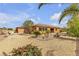 Charming single-story home boasts desert landscaping, mature trees, and a welcoming facade at , Las Vegas, NV 89113