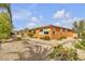 Charming single-story home boasts desert landscaping, mature trees, and a welcoming facade at , Las Vegas, NV 89113