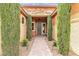 Charming front entrance with manicured greenery, a brick pathway, and an inviting front door at , Las Vegas, NV 89113