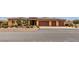 Charming single-story home with a well-manicured front yard, three-car garage, and beautiful desert landscaping at , Las Vegas, NV 89113