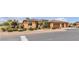 Inviting home featuring manicured landscaping with shrubbery, gravel beds, and a three-car garage at , Las Vegas, NV 89113