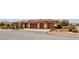 Attractive single-story home showcasing a three-car garage, desert landscaping, and a paver driveway at , Las Vegas, NV 89113