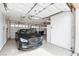 Clean, well-lit garage featuring epoxy flooring, multiple storage units, and a car at , Las Vegas, NV 89113