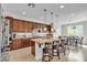 Bright eat-in kitchen features a center island, granite countertops, and stainless steel appliances at , Las Vegas, NV 89113