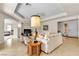 Inviting living room with an archway, light tile floors and a tray ceiling at , Las Vegas, NV 89113