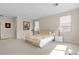 Spacious main bedroom featuring neutral tones, carpet flooring, and large windows offering ample natural light at , Las Vegas, NV 89113