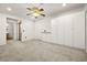 Spacious bedroom with large built-in cabinets, neutral carpet, and ceiling fan at 101 Luna Way # 222, Las Vegas, NV 89145