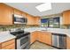 Bright kitchen featuring stainless steel appliances and tile backsplash at 101 Luna Way # 222, Las Vegas, NV 89145