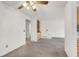 Open living room featuring carpet floors, built-in shelving, and an open entry way at 101 Luna Way # 222, Las Vegas, NV 89145