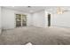 Bright living room with carpet flooring and large windows at 101 Luna Way # 222, Las Vegas, NV 89145
