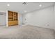 Open-concept living area with built in shelving at 101 Luna Way # 222, Las Vegas, NV 89145