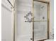 Bathroom shower featuring decorative accent tile and a glass door at 101 Luna Way # 222, Las Vegas, NV 89145