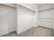 Walk-in closet with neutral carpet and clothing racks at 101 Luna Way # 222, Las Vegas, NV 89145