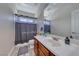 Bathroom with wood cabinets, neutral walls, and new fixtures at 1033 Logan Patrick Dr, Henderson, NV 89052