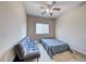 Cozy bedroom with carpet flooring, ceiling fan and natural lighting at 1033 Logan Patrick Dr, Henderson, NV 89052