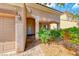 Close-up of the front entrance featuring a tiled entryway and well-maintained landscaping at 1033 Logan Patrick Dr, Henderson, NV 89052