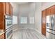 Bright kitchen area with stainless steel appliances, ample cabinet space, and large windows at 1033 Logan Patrick Dr, Henderson, NV 89052