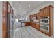 Beautiful kitchen with granite countertops, stainless appliances, and open layout to the living room at 1033 Logan Patrick Dr, Henderson, NV 89052