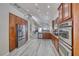 Modern kitchen with stainless appliances, granite countertops, and an open view to the living room at 1033 Logan Patrick Dr, Henderson, NV 89052