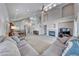 Bright and airy living room with fireplace, high ceilings, and neutral colors throughout at 1033 Logan Patrick Dr, Henderson, NV 89052