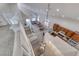 Aerial view of a combined living and kitchen area with stairs to the upper floor at 1033 Logan Patrick Dr, Henderson, NV 89052