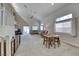 Bright, open living room with high ceilings, large windows, and a comfortable seating area at 1033 Logan Patrick Dr, Henderson, NV 89052