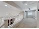 Bright loft with built-in shelving, carpet flooring, ceiling fan, and natural light at 1033 Logan Patrick Dr, Henderson, NV 89052