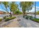 Neighborhood featuring desert landscaping and a well-maintained central park area at 1033 Logan Patrick Dr, Henderson, NV 89052